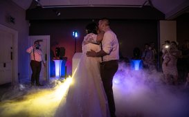 couple dancing on a cloud of dry ice during first dance at a wedding reception ar Stancliffe hall