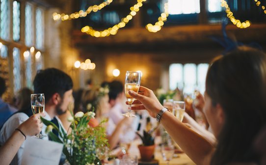 wedding guests toastin during speeches at a wedding breakfast